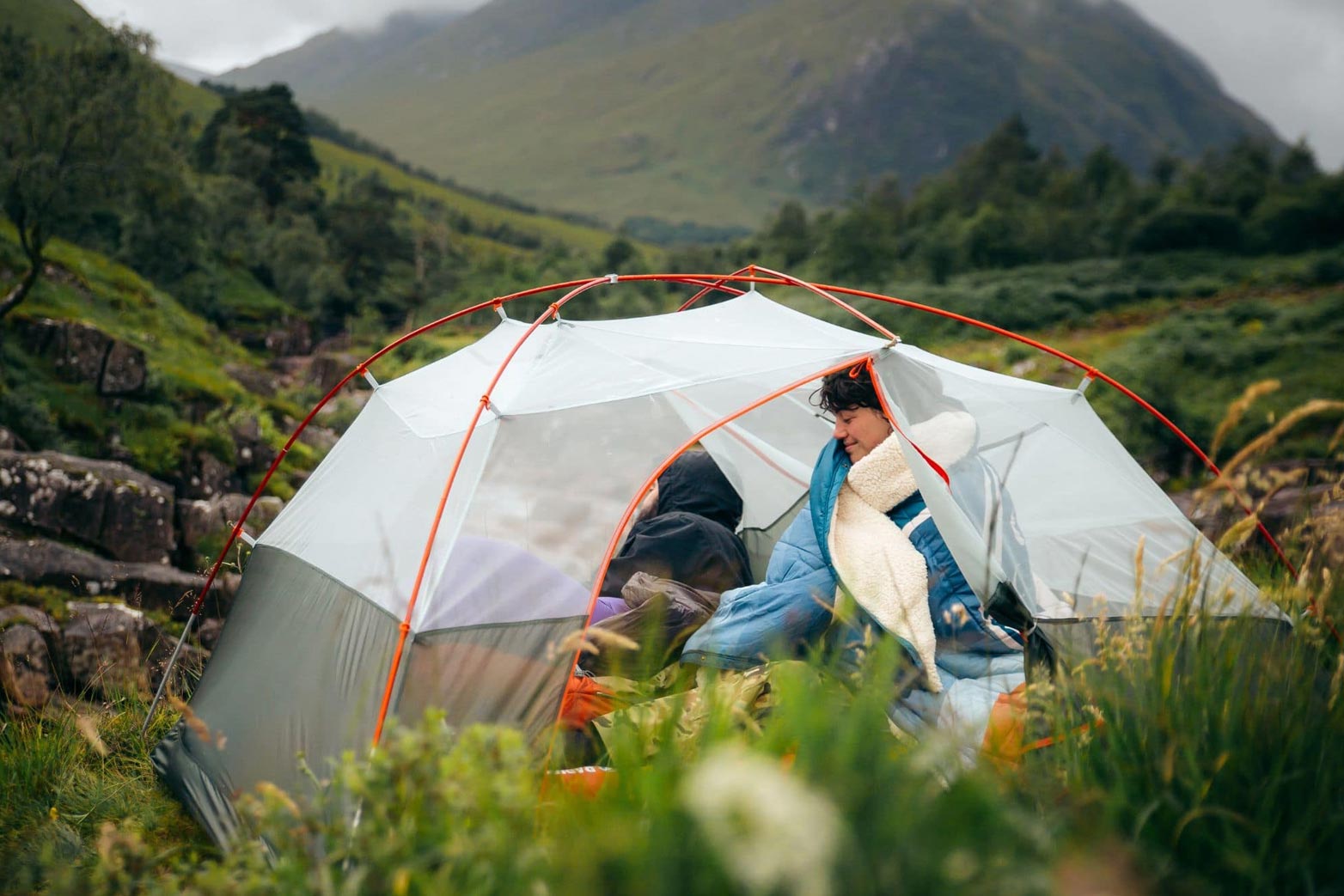 Young couple in a tent on a weekend camping trip