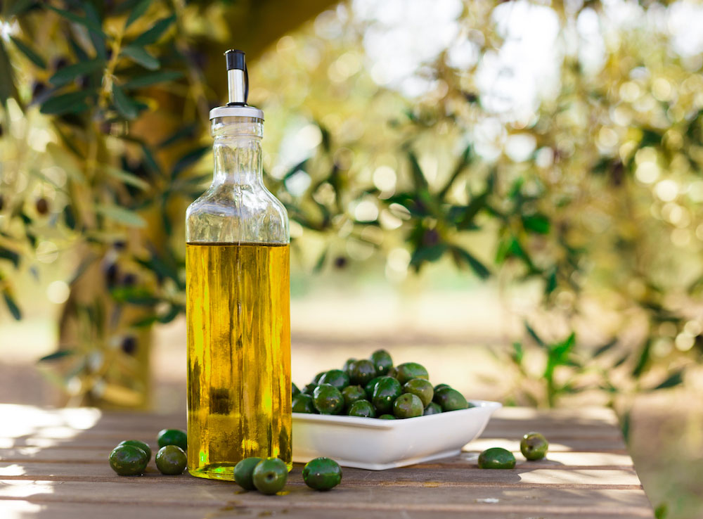 Bottled EVOO on a sunny table